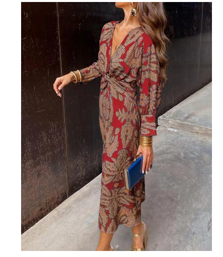 Nine-quarter sleeve V-neck painted dress by M Chic Boutique, featuring a stylish pattern and flowy fabric.