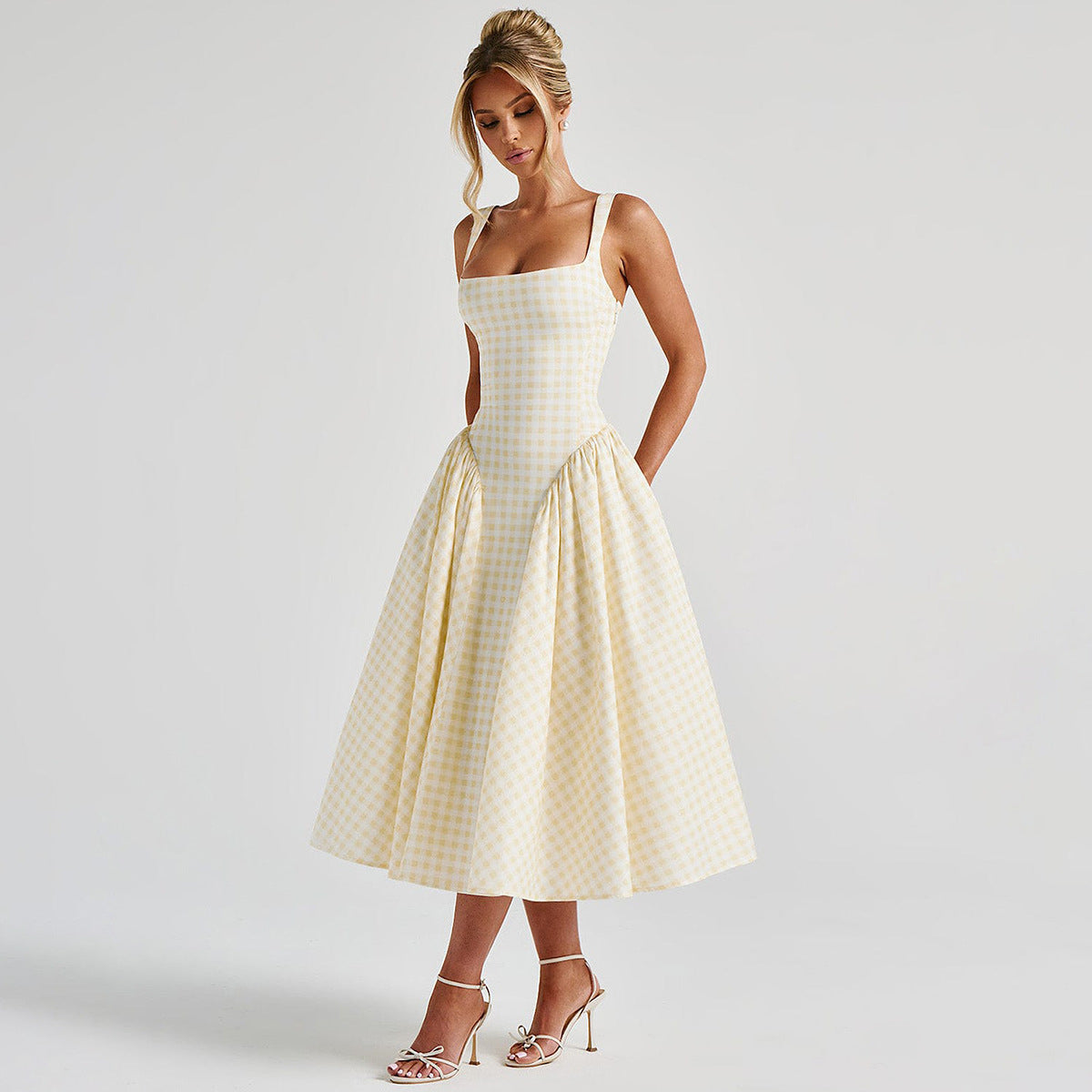 French Style Strap Dress by M Chic Boutique, showcasing a sleeveless, elegant dress with a fitted waist and flowing skirt.