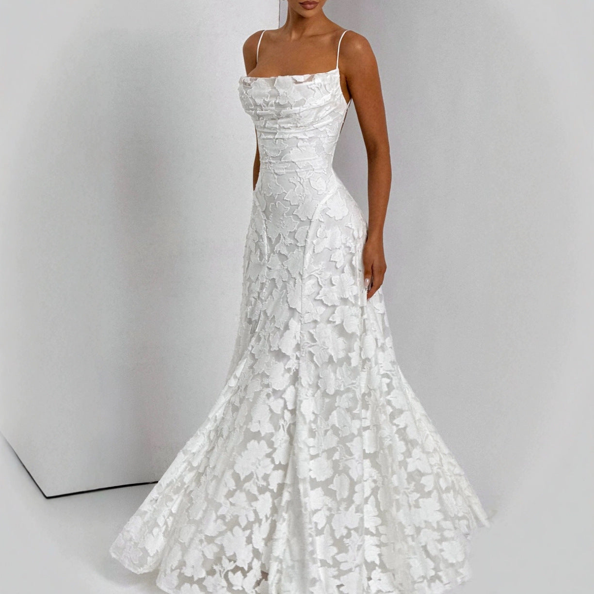 Backless lace-up design dress by M Chic Boutique, featuring a flowy silhouette and intricate lace details.
