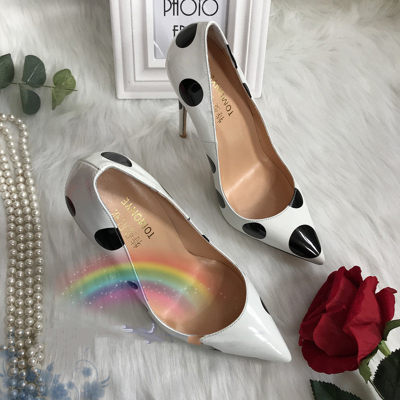 Polka dot leather high heels by M Chic Boutique, featuring a stylish design and elegant silhouette.