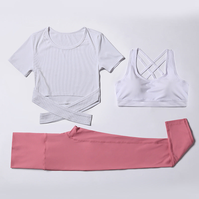 Three-piece M Chic Boutique activewear gym and yoga suit with matching top, leggings, and sports bra in vibrant colors.