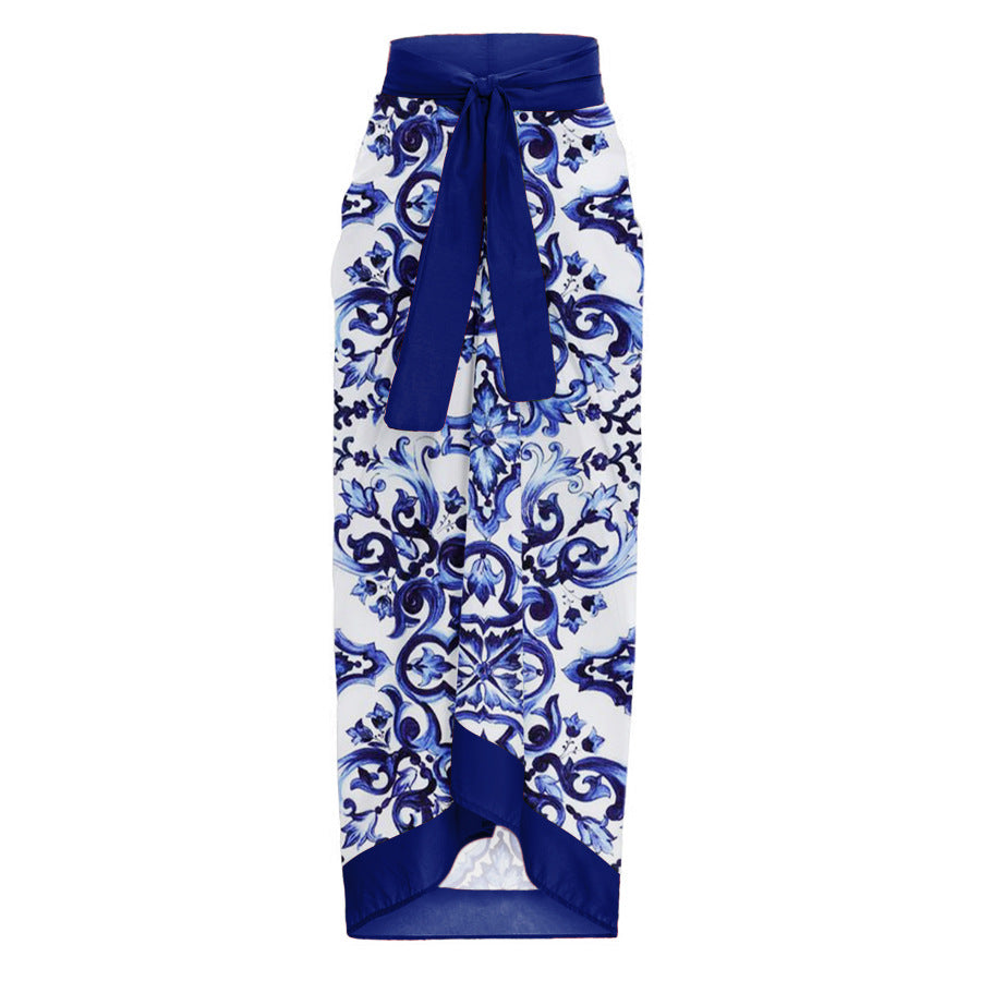 One-piece blue and white porcelain printed swimsuit for women by M Chic Boutique, showcasing elegant floral patterns.
