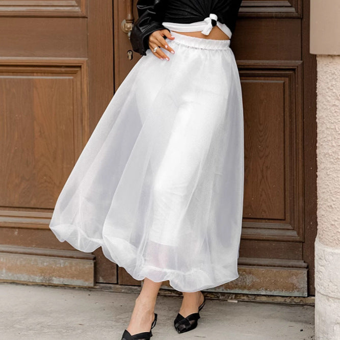 Black mesh high waist skirt from M Chic Boutique, featuring a flowy design and elegant silhouette suitable for various occasions.