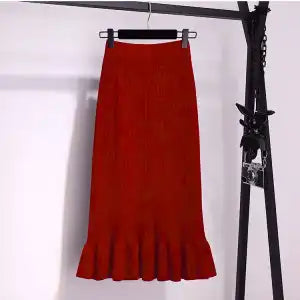 Ruffled high waisted skirt in a flowy design, showcasing elegant fabric and stylish silhouette from M Chic Boutique.