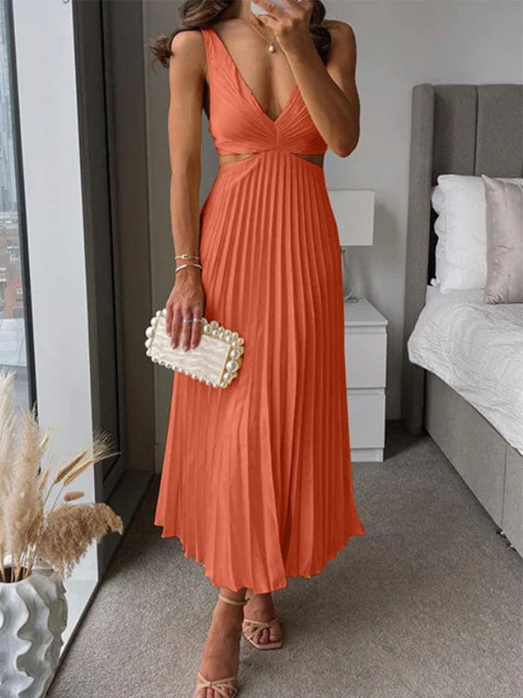 M Chic Boutique suspender pleated long dress displayed on a hanger, featuring a flowing fabric and stylish design.