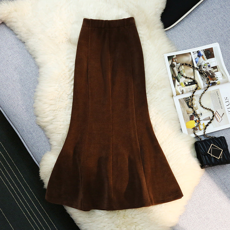 Slim fit elegant mermaid skirt in black, featuring a flared hem and sleek silhouette from M Chic Boutique.