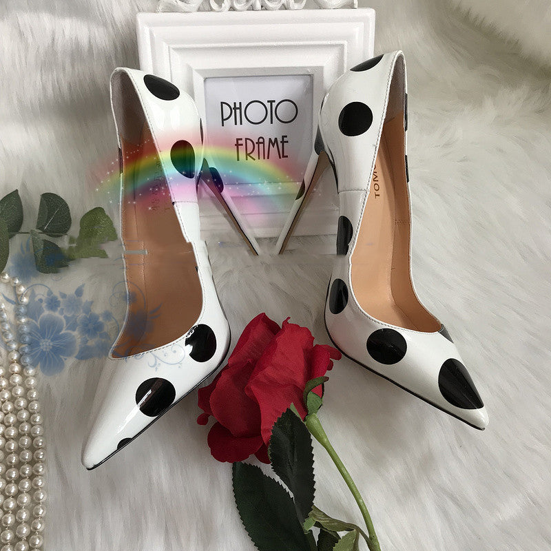 Polka dot leather high heels from M Chic Boutique with a stylish design and a sleek silhouette.