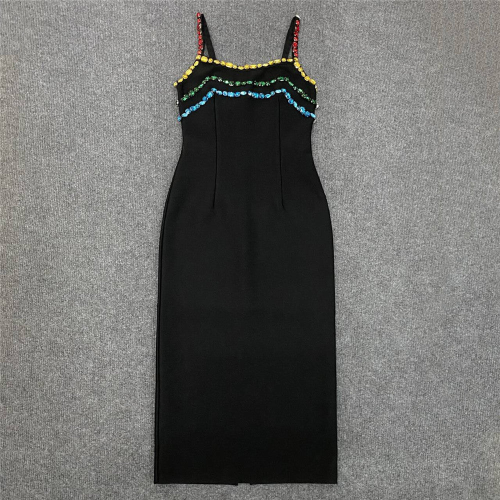 Rhinestone sling dress by M Chic Boutique, featuring a sparkling design and elegant silhouette on a mannequin.