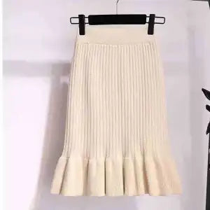Ruffled high waisted skirt in a flowy design, featuring soft fabric and a stylish silhouette from M Chic Boutique.