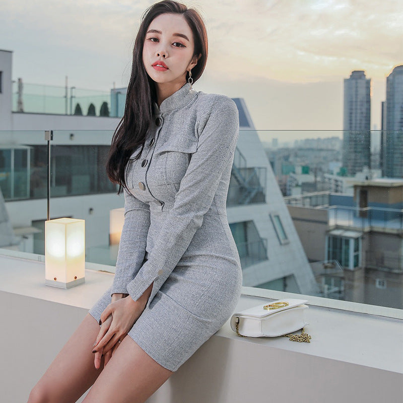 Single-breasted elegant dress from M Chic Boutique, featuring a tailored fit and classic design in a stylish setting.