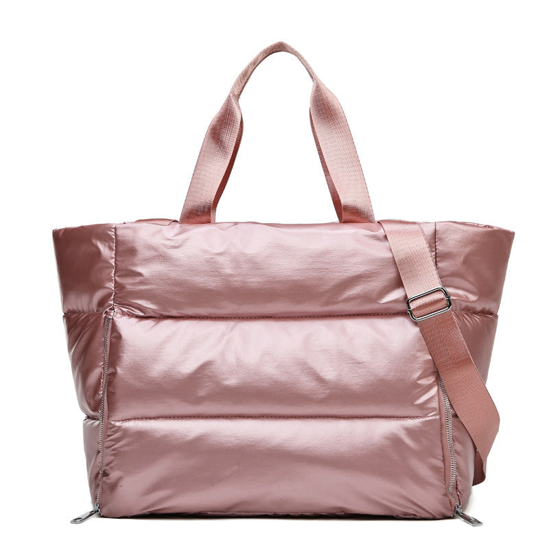 Women's gym bag by M Chic Boutique, stylish and spacious bag with shoulder straps and multiple compartments for workout essentials.