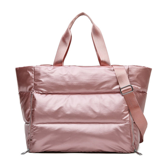 Women's gym bag by M Chic Boutique, stylish and spacious bag with shoulder straps and multiple compartments for workout essentials.