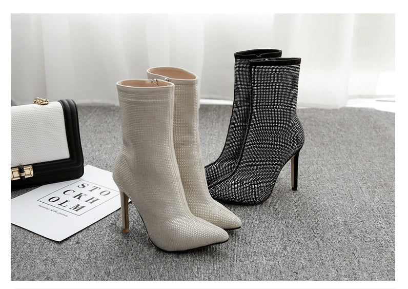 Pointed rhinestone high heel boots by M Chic Boutique, featuring a sleek design and sparkling embellishments.