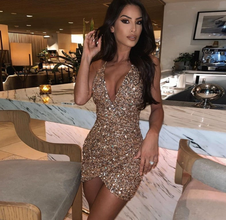 Sequin suspender dress by M Chic Boutique featuring a stylish, shimmering design and adjustable straps for a fashionable look