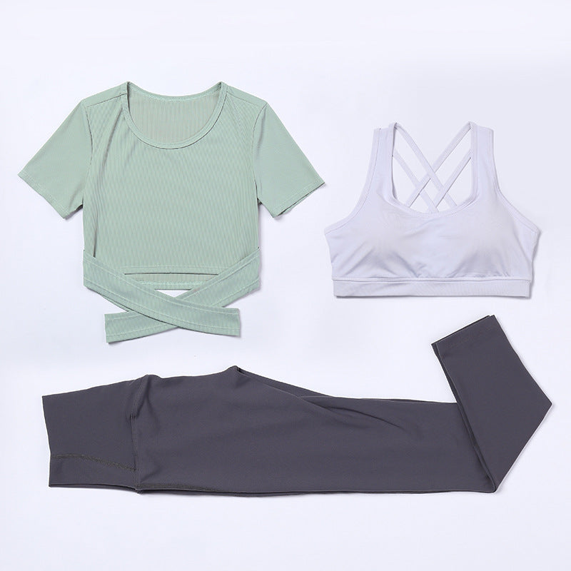 Three-piece M Chic Boutique activewear yoga and gym suit with matching top, leggings, and sports bra displayed on white background.