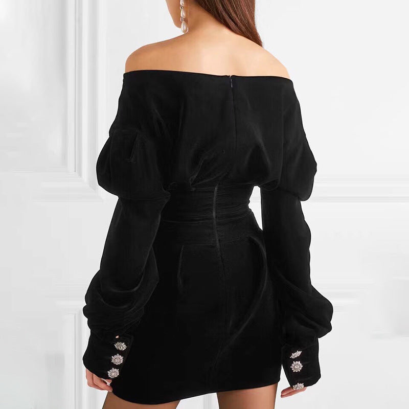Elegant M Chic Boutique dress with a flowing silhouette and intricate detailing, displayed on a mannequin.