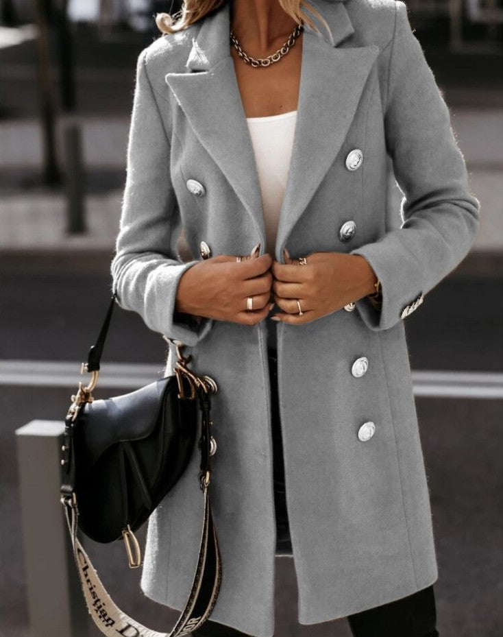 Double-breasted woolen coat in a classic design, featuring a tailored fit and neutral color from M Chic Boutique.