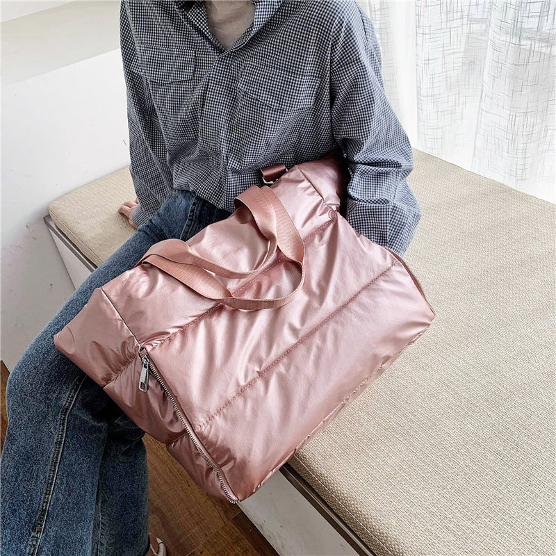 Women's gym bag by M Chic Boutique, stylish bag with compartments for workout gear and accessories.