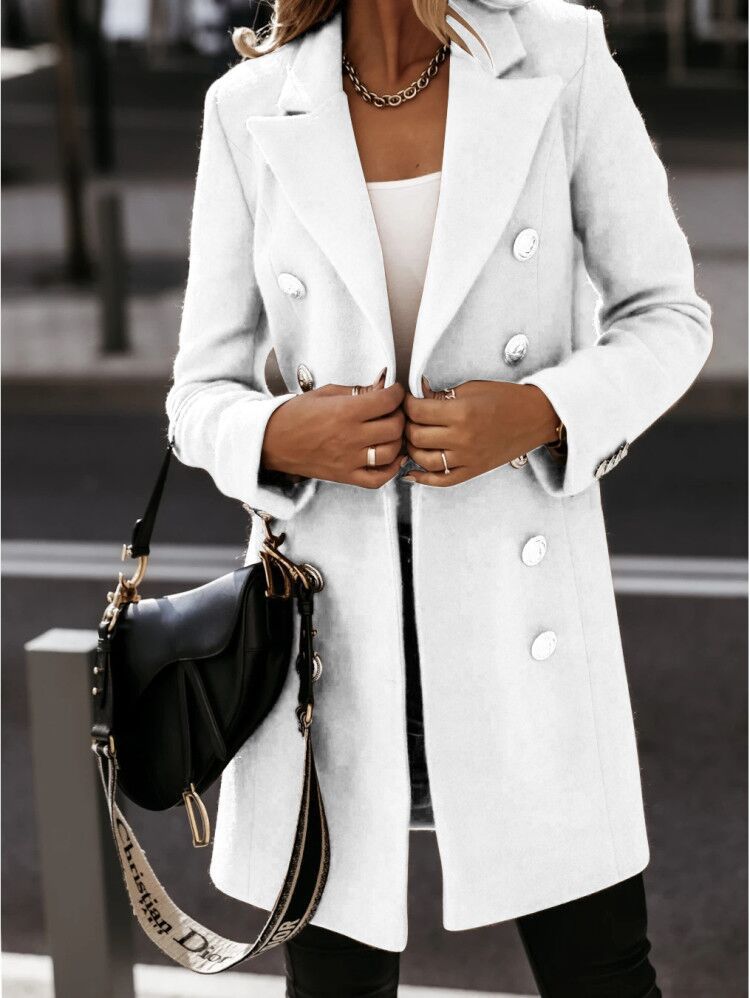 Double-breasted woolen coat in a stylish design by M Chic Boutique, featuring a tailored fit and classic lapels.