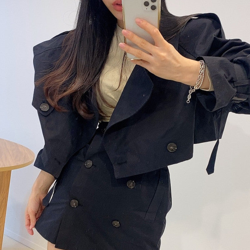 Two-piece double-breasted suit from M Chic Boutique, featuring a tailored blazer and matching trousers on a model.