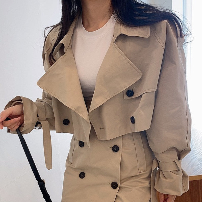 Two-piece double-breasted suit from M Chic Boutique, featuring a tailored blazer and matching trousers, displayed on a hanger.