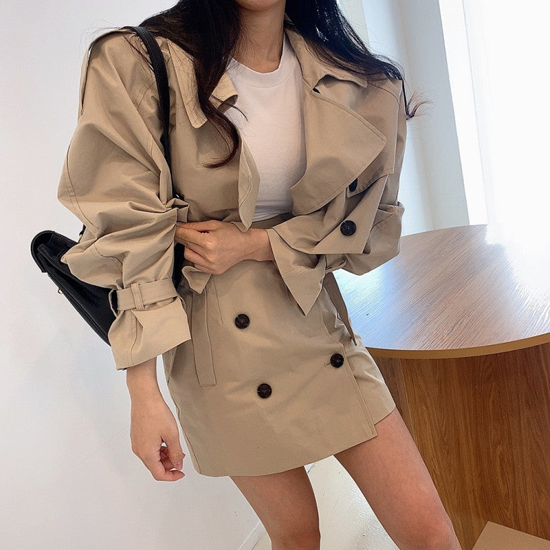 Two-piece double-breasted suit set by M Chic Boutique, featuring a tailored blazer and matching trousers, on a plain background.