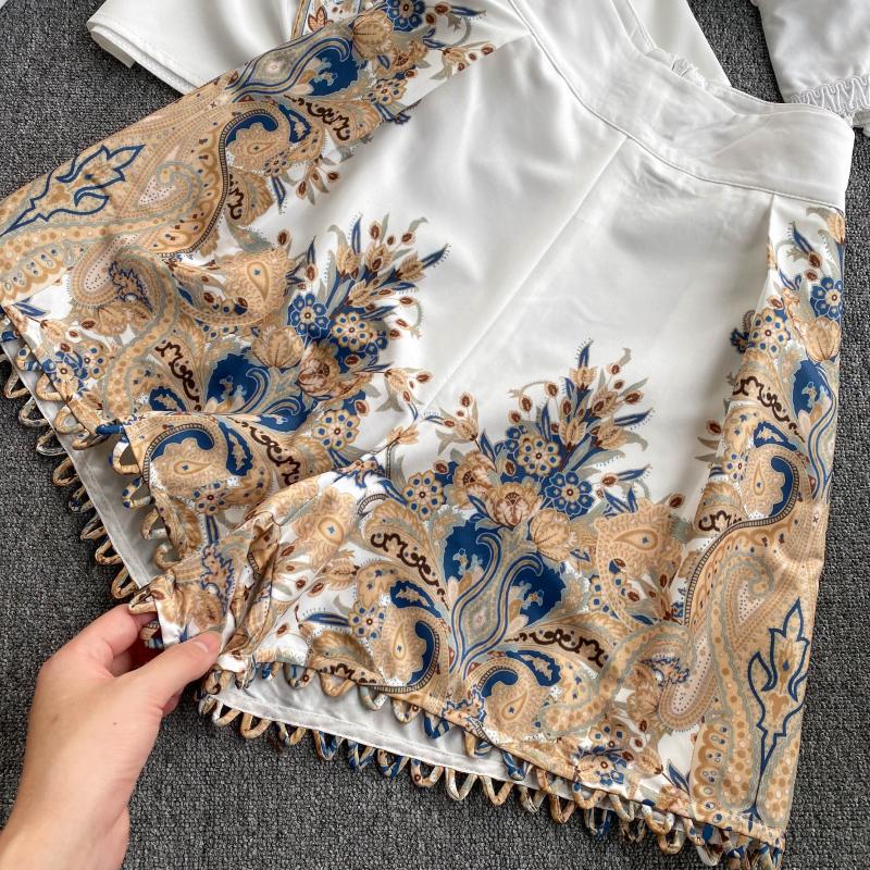 Two-piece French Temperament suit by M Chic Boutique, featuring a tailored jacket and matching trousers in elegant fabric.