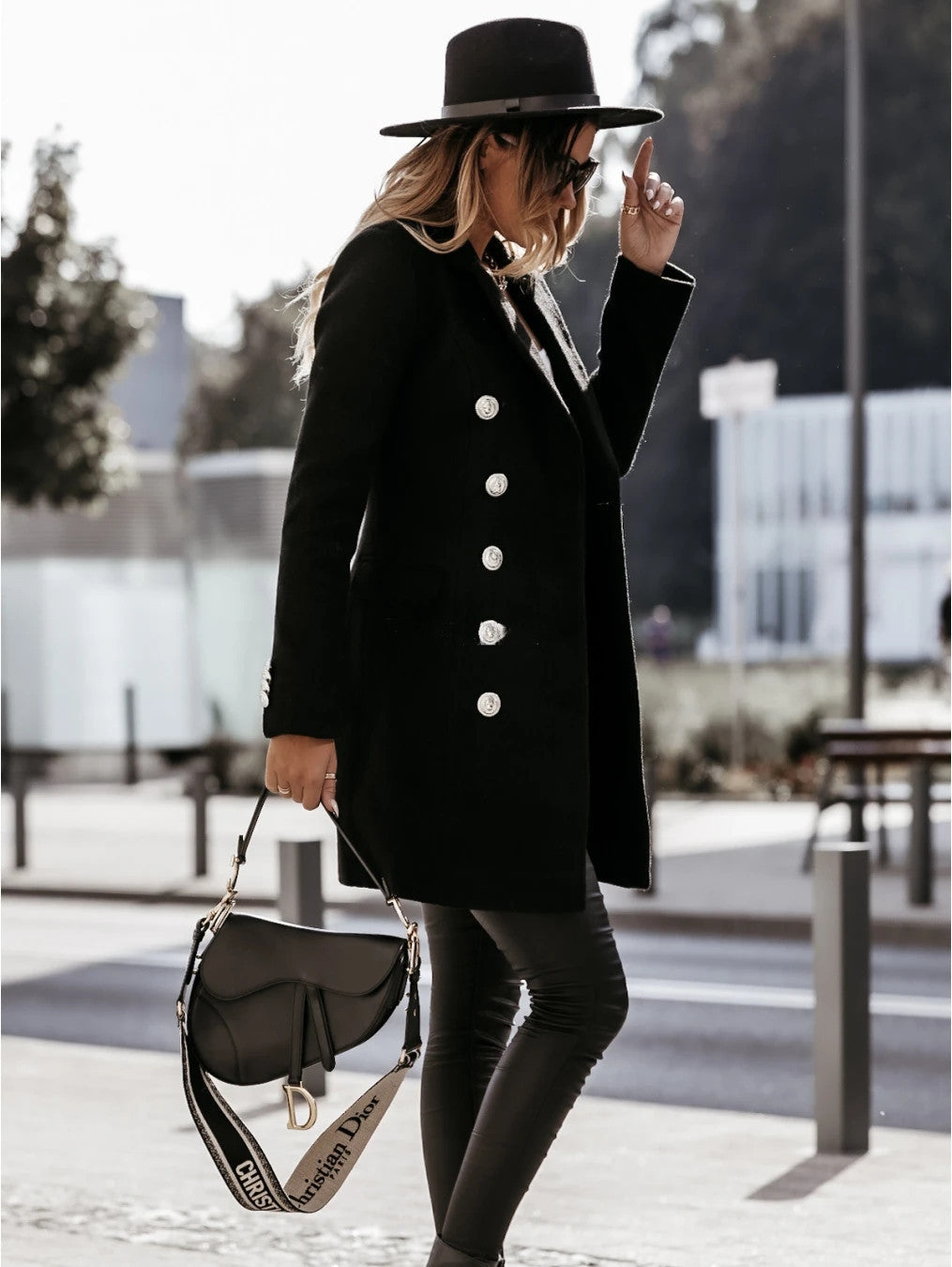 Double-breasted woolen coat by M Chic Boutique in a stylish fit, showcasing a classic design and soft texture.
