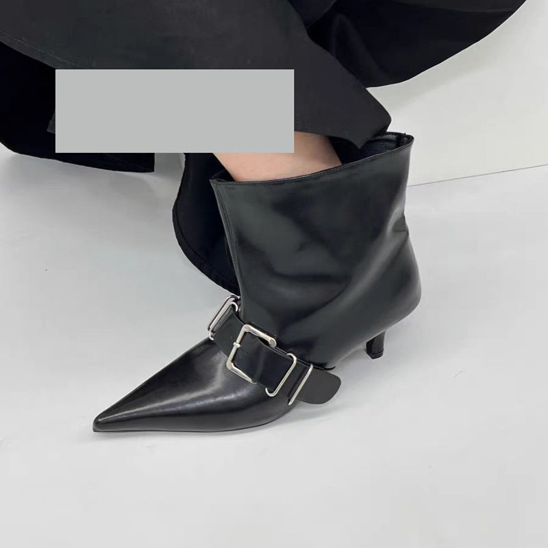 High heel pointed ankle boots by M Chic Boutique in sleek black leather with a stylish pointed toe design.