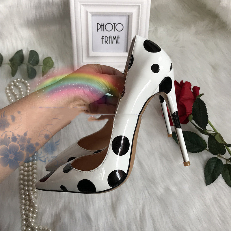 Polka dot leather high heels by M Chic Boutique, featuring a stylish design with a pointed toe and elegant silhouette.