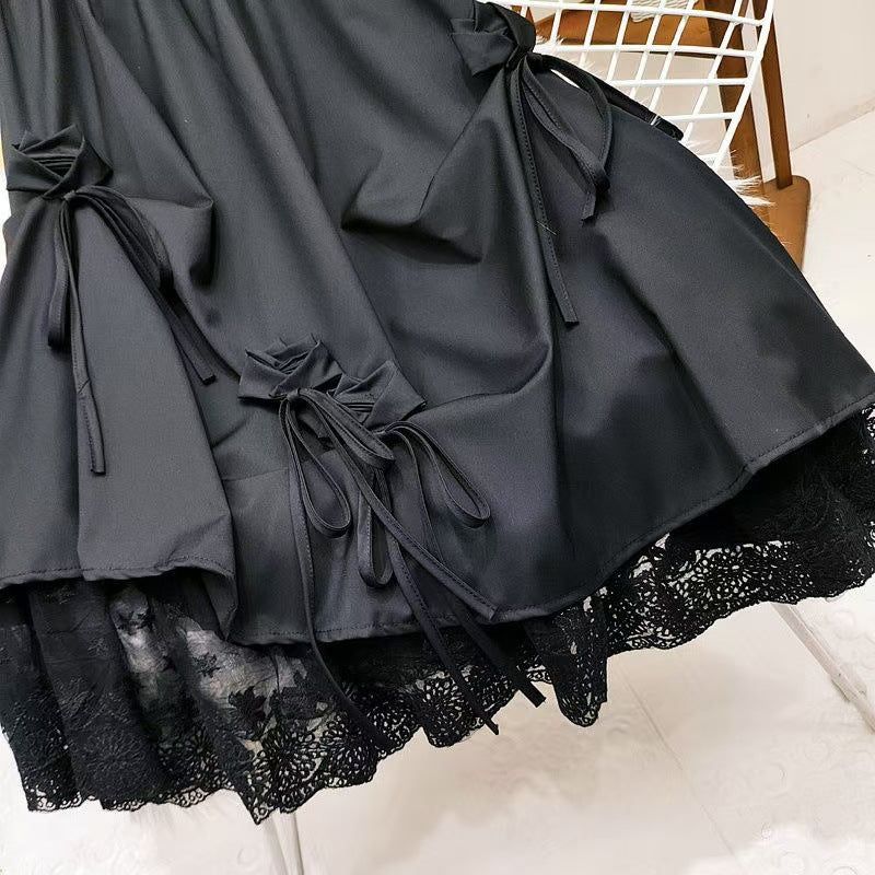 High-waisted bow midi skirt in a flowing fabric, perfect for elegant outfits, by M Chic Boutique.