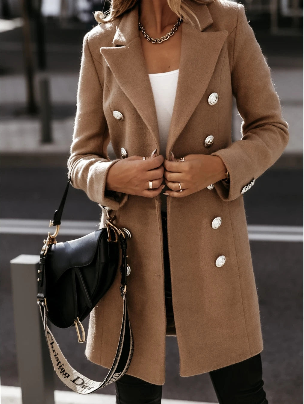 Double-breasted woolen coat in a classic style, featuring a tailored fit and elegant buttons from M Chic Boutique.