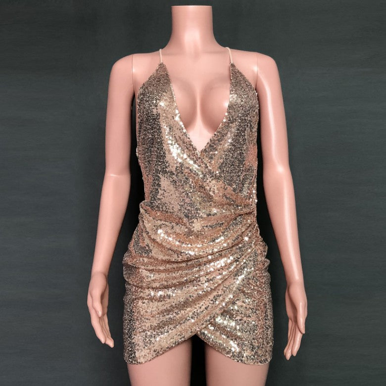 Sequin suspender dress from M Chic Boutique featuring a stylish, shimmering design perfect for special occasions.