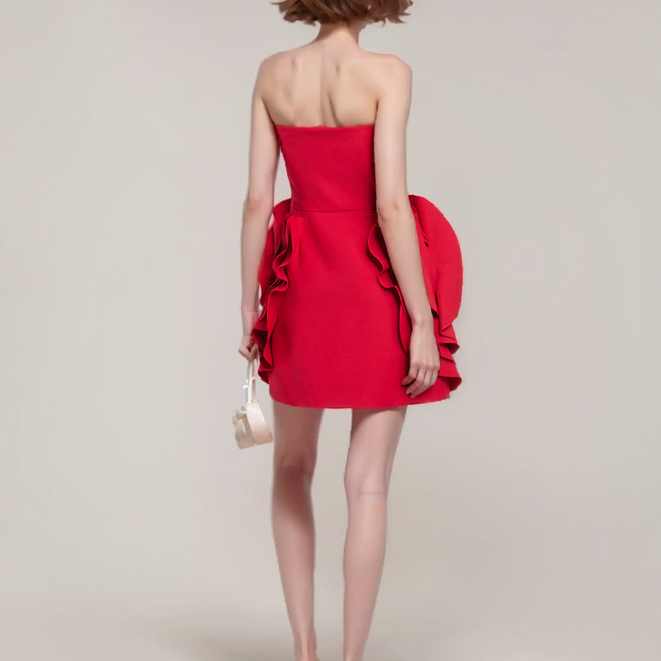 Red short flower dress by M Chic Boutique featuring a vibrant floral pattern and a flirty silhouette.