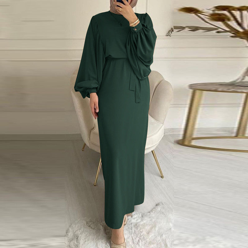 Solid color elegant dress by M Chic Boutique, featuring a flattering silhouette and smooth fabric draping.