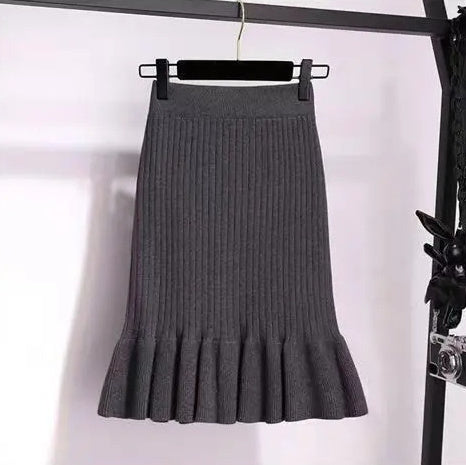 Ruffled high waisted skirt in a flowy design, showcasing soft fabric and elegant movement, by M Chic Boutique.