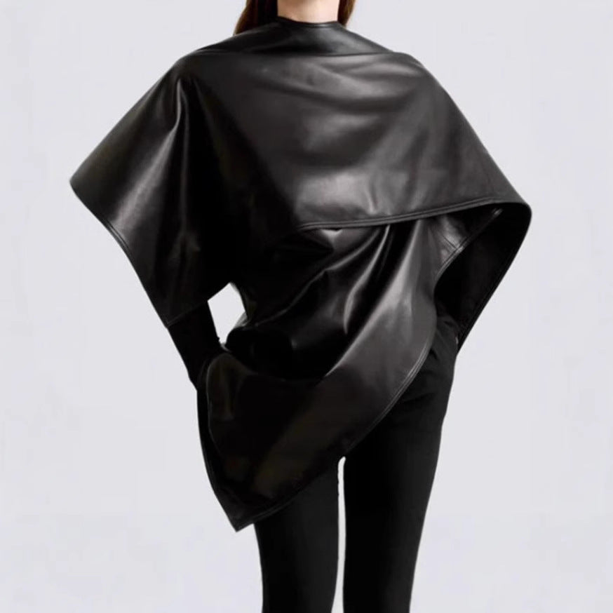 M Chic Boutique Trend Shawl Cape Coat draped over a mannequin, showcasing its stylish design and cozy fabric for fall fashion.