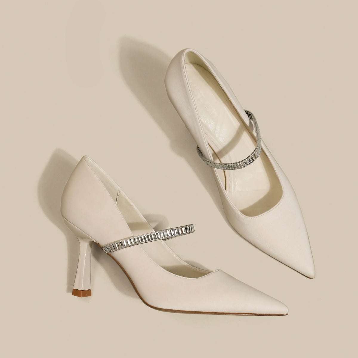 Pointed toe shoes with strap from M Chic Boutique, featuring a sleek design and elegant silhouette in a stylish color.