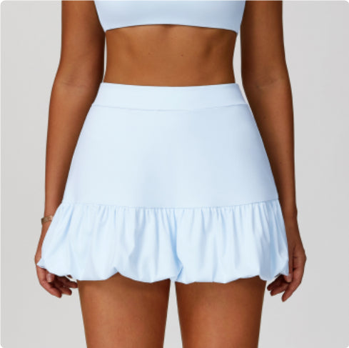 Quick-drying tennis skirt from M Chic Boutique, activewear with a sporty fit and lightweight fabric for athletic performance.