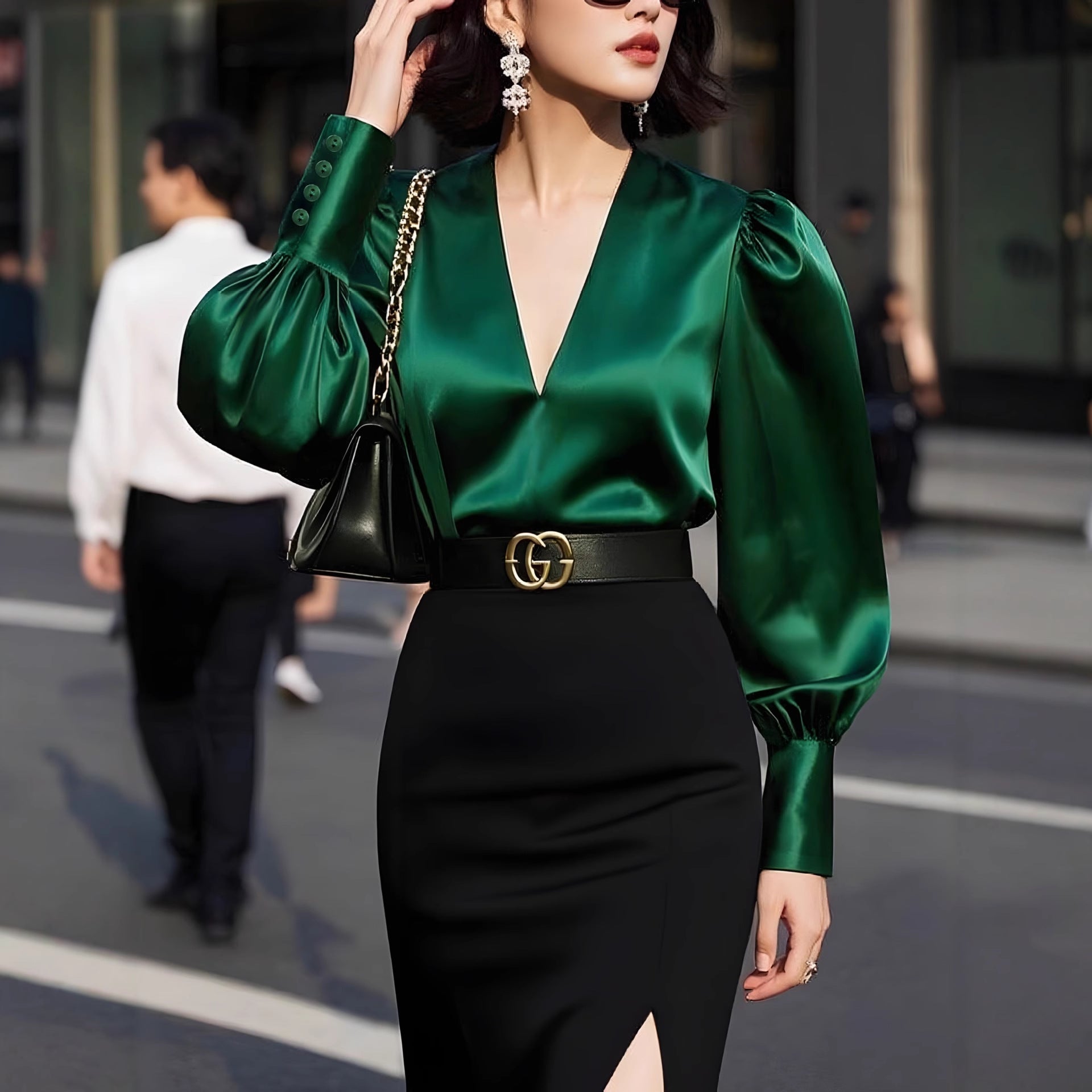 Solid-color v-neck silk satin shirt by M Chic Boutique, showcasing a smooth fabric and elegant drape on a model.