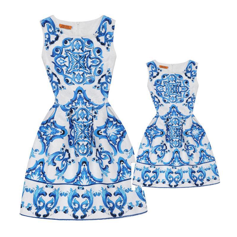 M Chic Boutique printed A-line dress featuring a colorful floral pattern and a flattering silhouette on a white background.