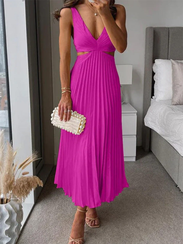 M Chic Boutique suspender pleated long dress with shoulder straps and flowing fabric, styled for a sophisticated look.
