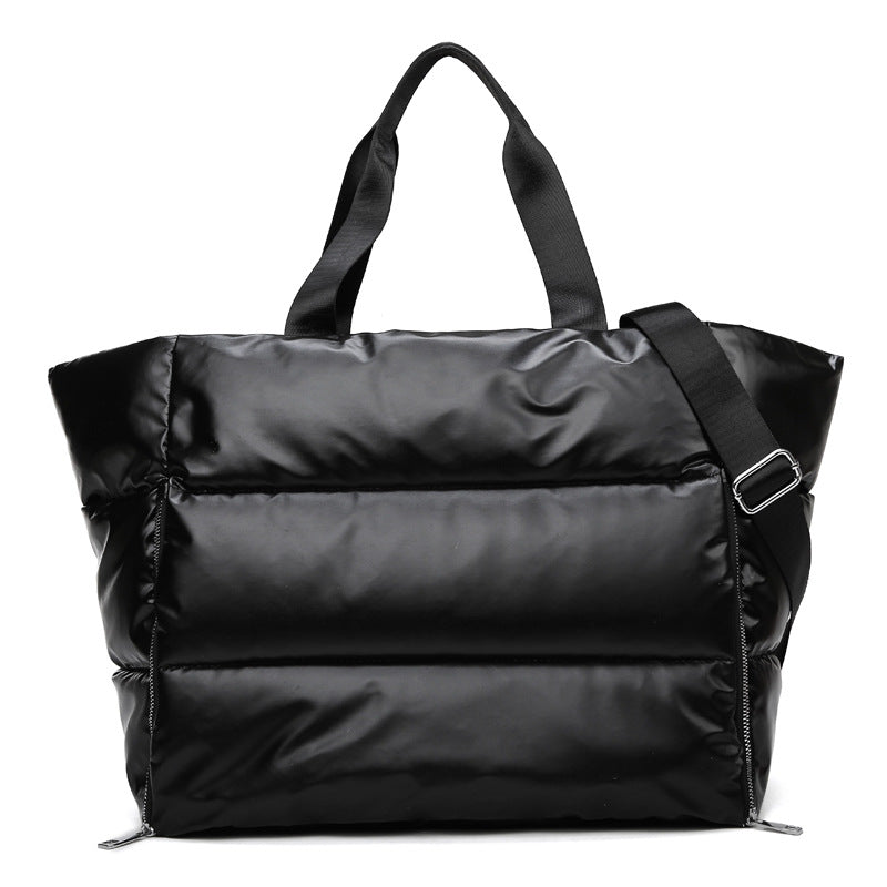 Women's gym bag by M Chic Boutique, stylish and spacious bag with handles and compartments for workout essentials.