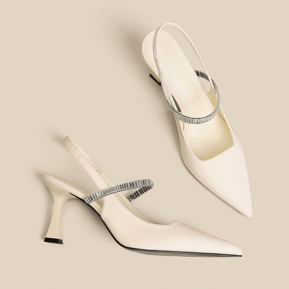 Pointed toe shoes with strap from M Chic Boutique, featuring a sleek design and elegant silhouette in a stylish color.
