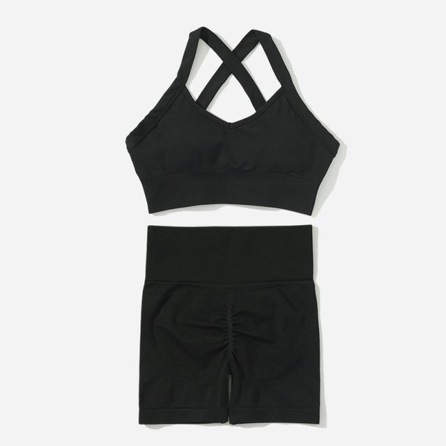 M Chic Boutique sport solid color activewear set featuring a fitted top and matching leggings on a neutral background.