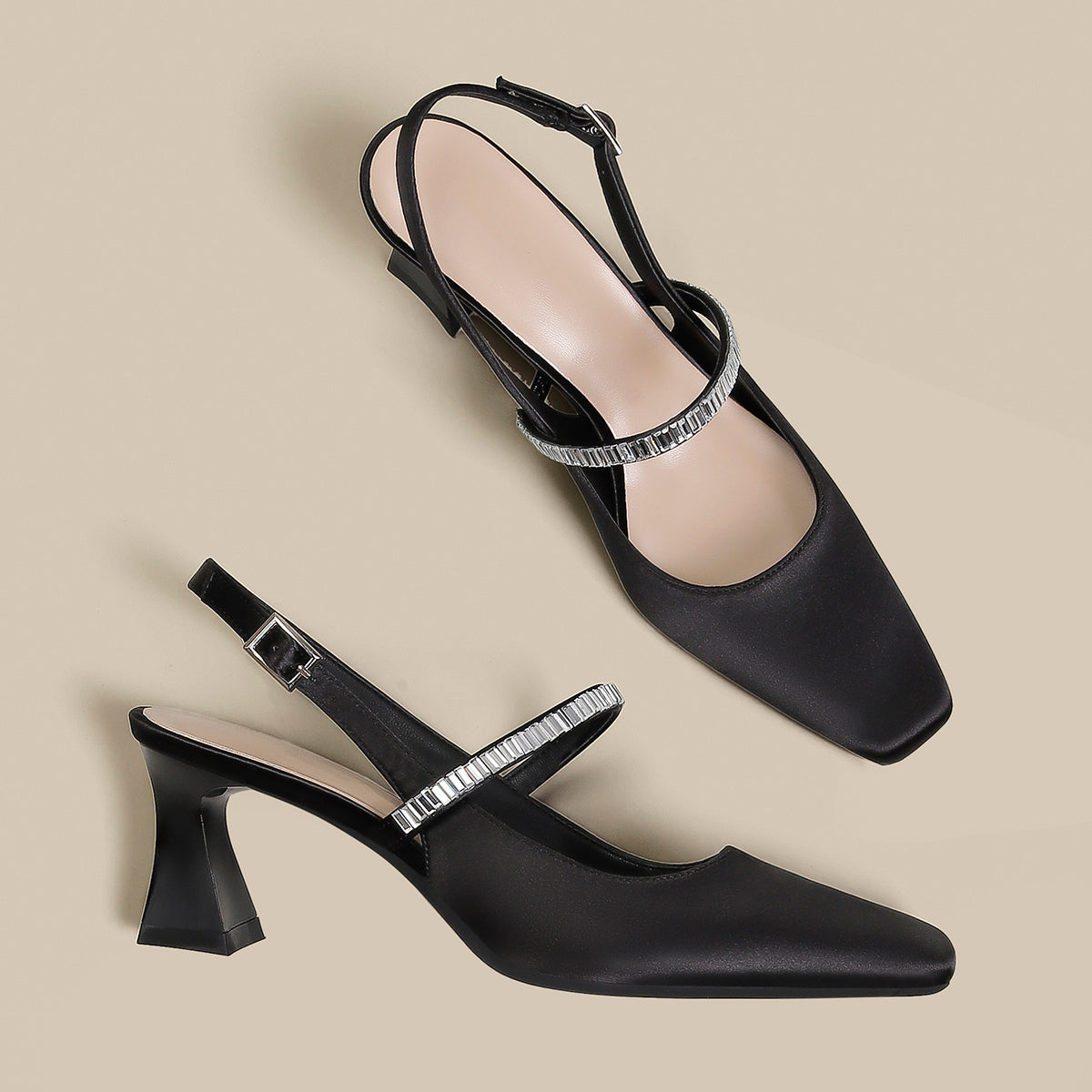 Pointed toe shoes with strap in black from M Chic Boutique, featuring a sleek design and elegant silhouette.