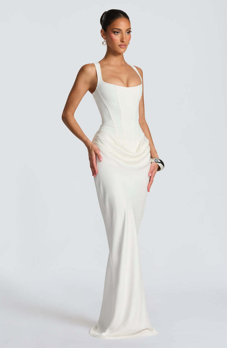 Elegant strapless sleeveless sheath maxi dress by M Chic Boutique, featuring a fitted silhouette and flowing fabric.
