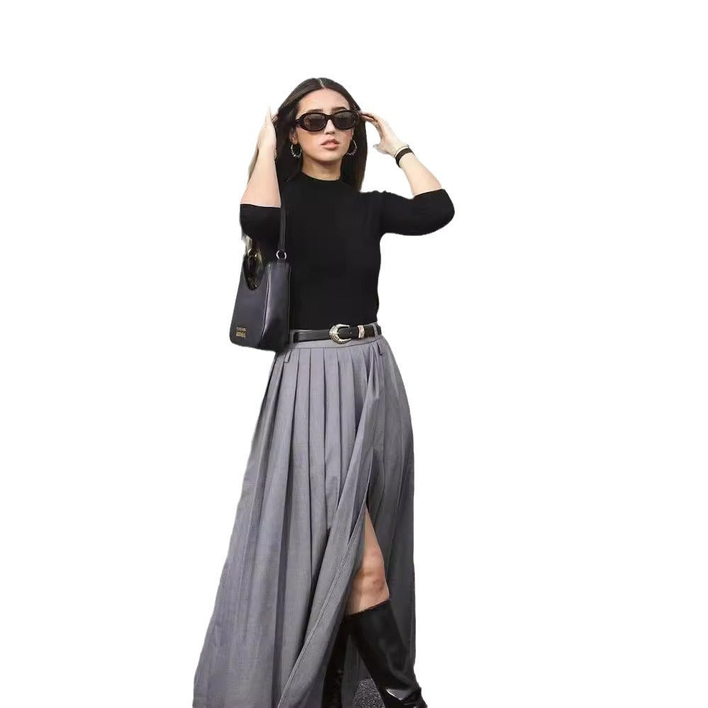 High waist slit pleated skirt in flowing fabric, showcasing elegant pleats and a stylish slit, by M Chic Boutique.