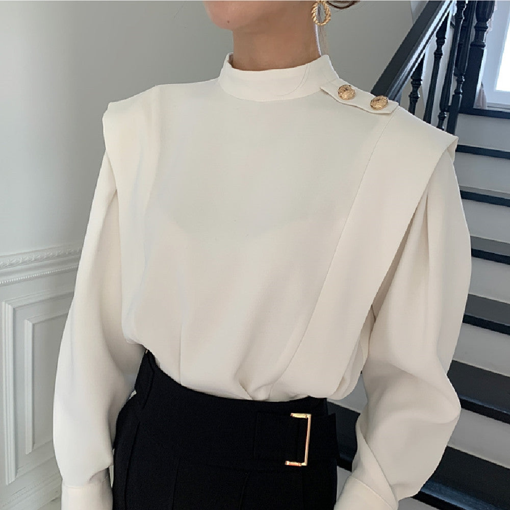 Half high collar shirt in white, styled with a flowy skirt, showcasing M Chic Boutique's elegant design and fabric texture.