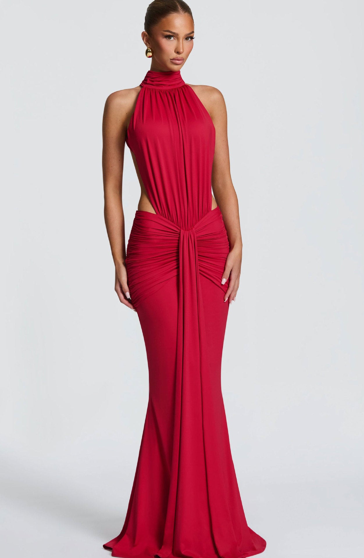 Halterneck pleated slim-fit dress from M Chic Boutique, featuring a stylish design with a fitted silhouette and elegant pleats.